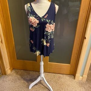 Tank top has blue over lay on top of print